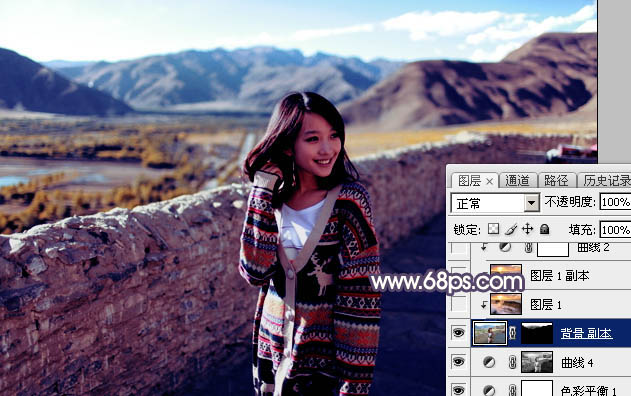 Photoshop将高原山区人物图片调至出灿烂的霞光色