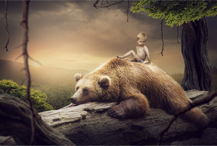 PS合成坐在温顺大灰熊背上的小男孩图片