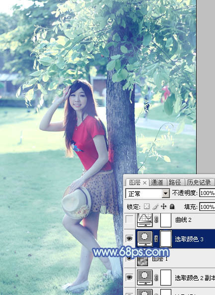 Photoshop给树边的女孩加上流行的淡调青蓝色