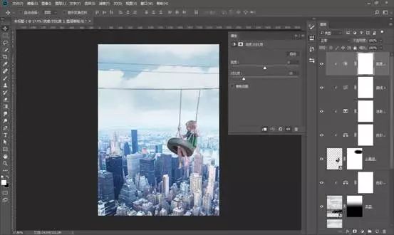场景合成，通过PS合成在城市上空荡秋千的男孩