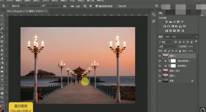 Photoshop给海边城市风景照调出一种漂亮的落日晚霞效果。